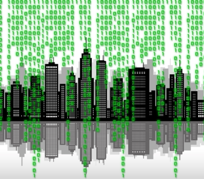 Matrix code in front of a silhouette of a city